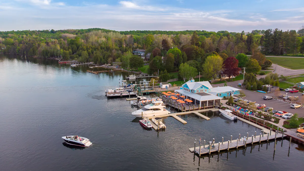 a boat is docked next to a body of water